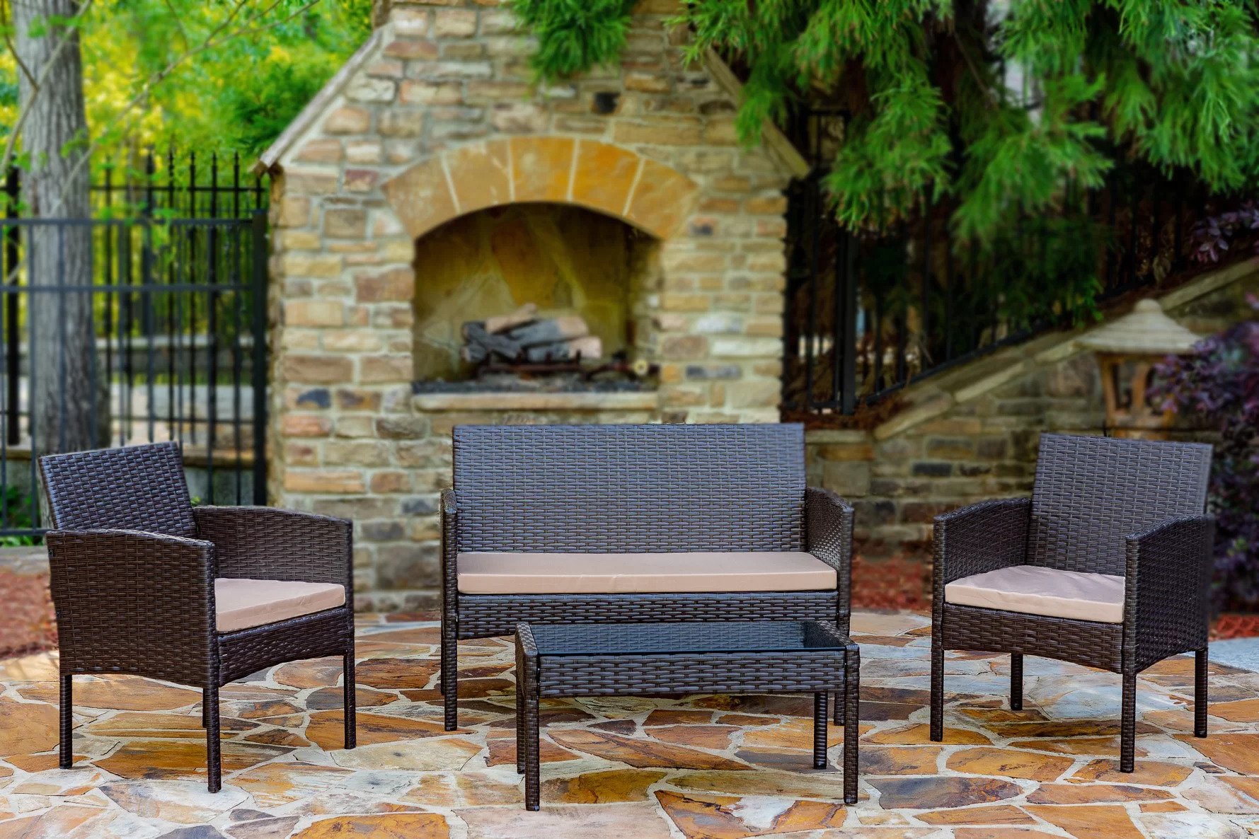 A photo of the Lark Manor Wicker Set on an outdoor patio