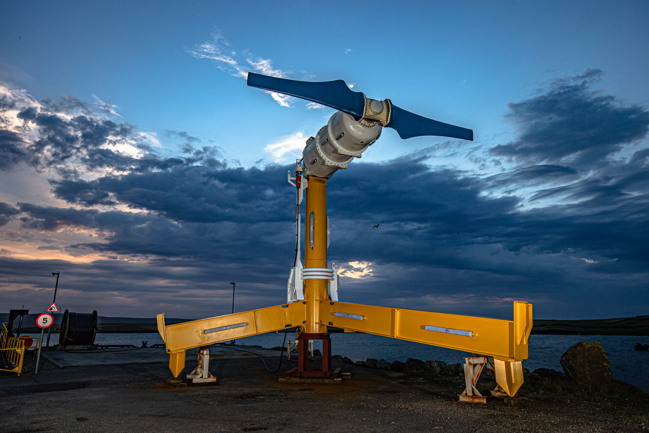 Tidal turbine against cloudy sky.