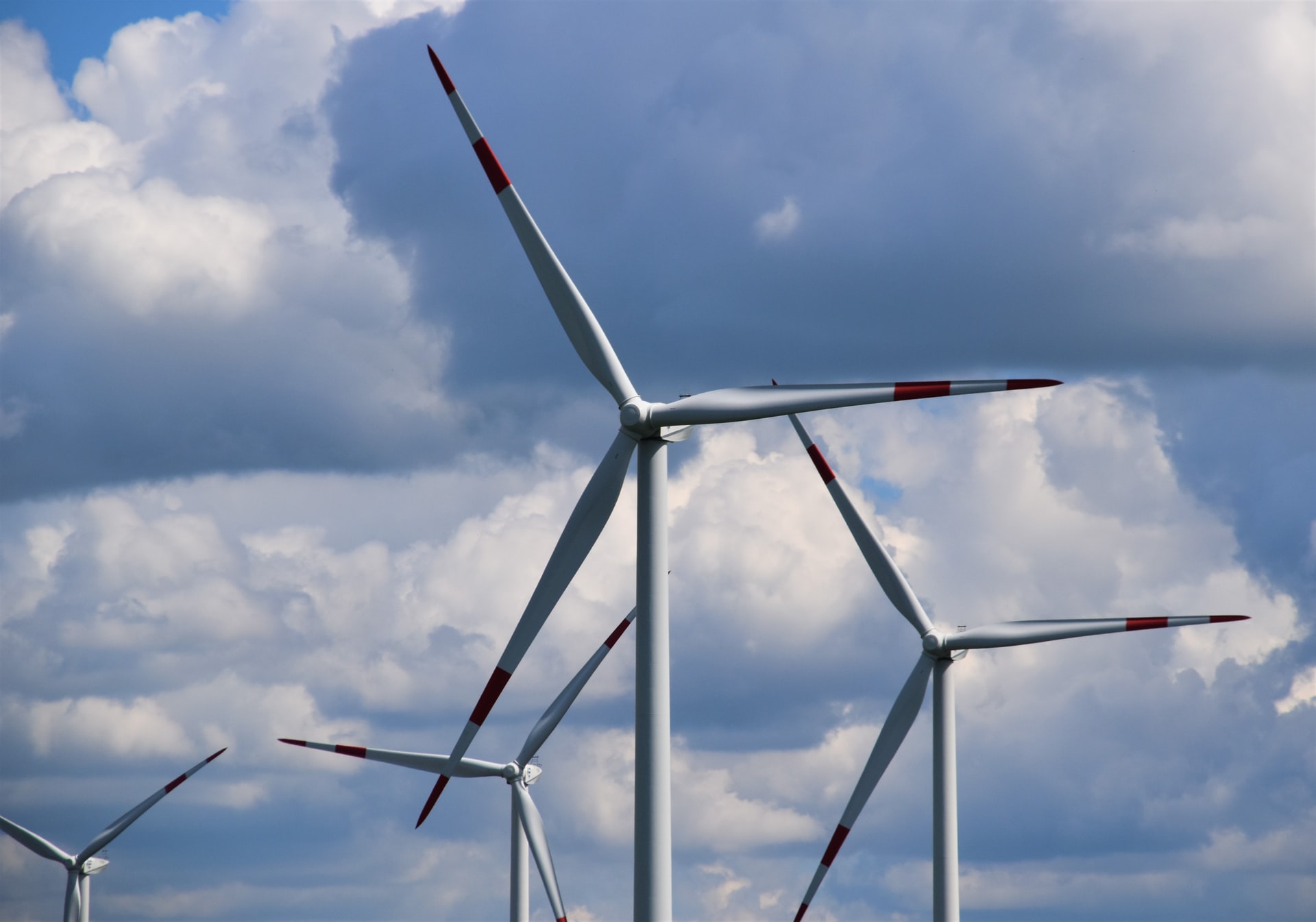 Offshore wind turbine against cloudy sky