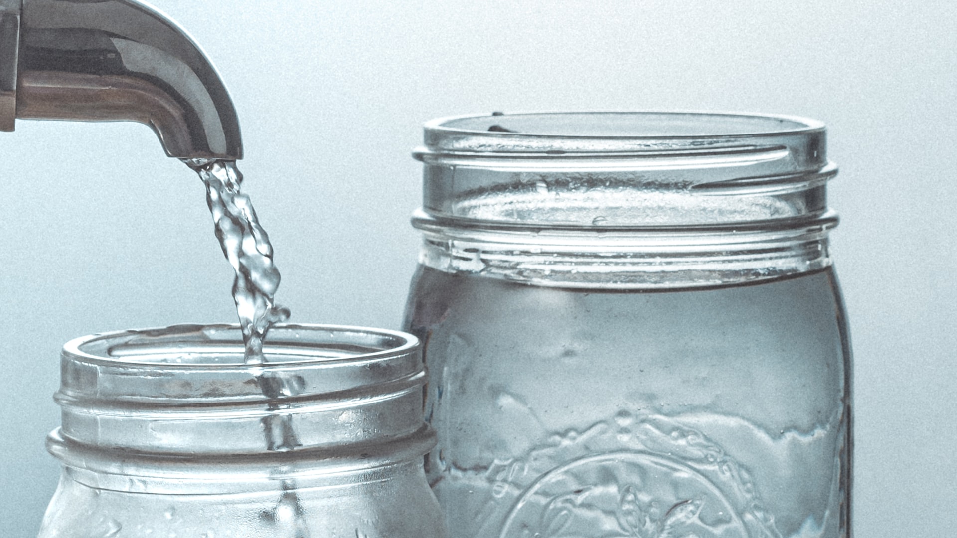 Water glasses being filled.