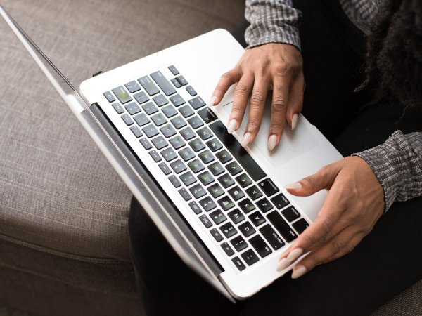 person typing on laptop