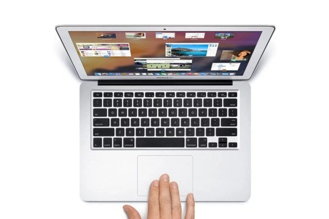 A person using a Macbook Air