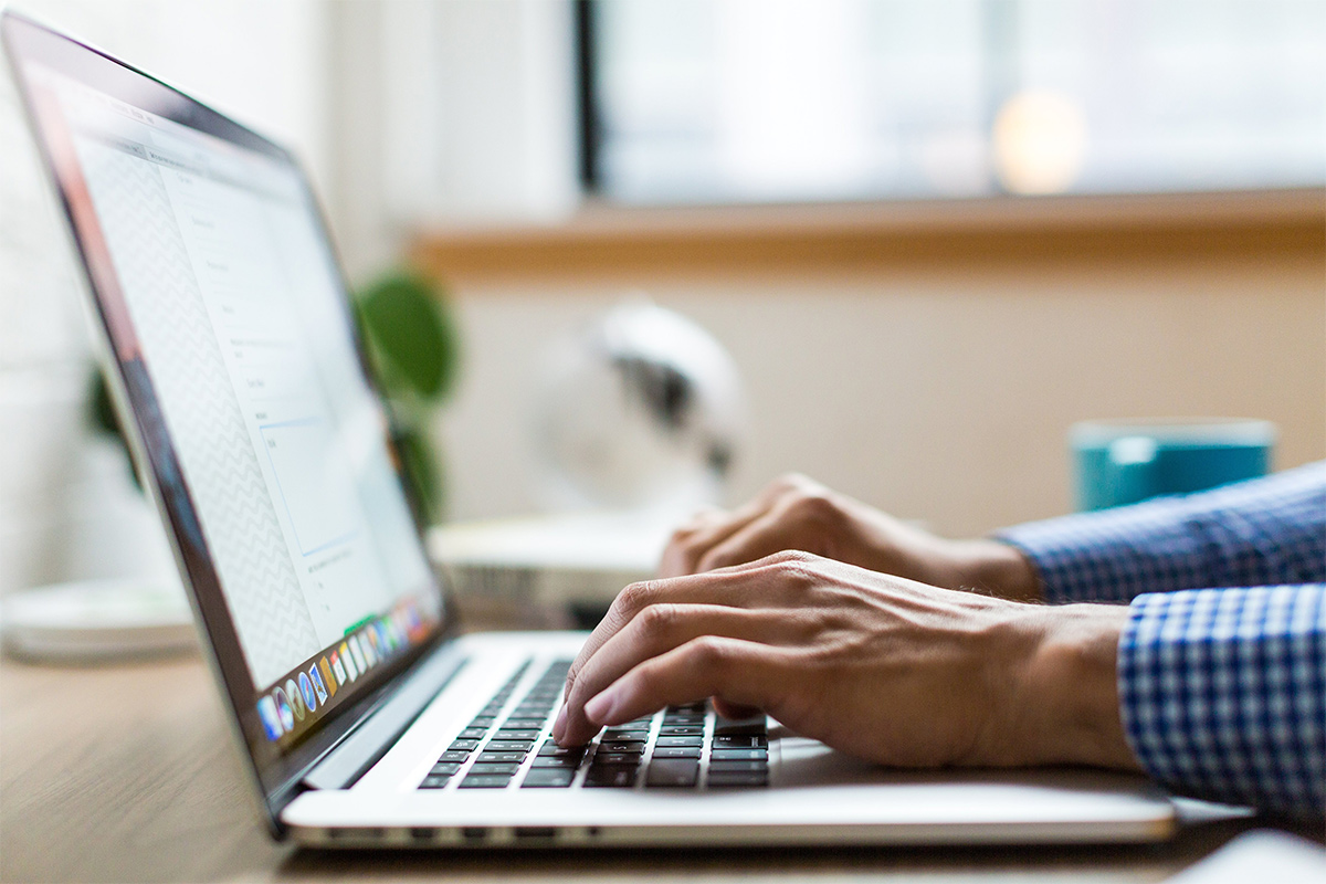 An image of a person using a laptop