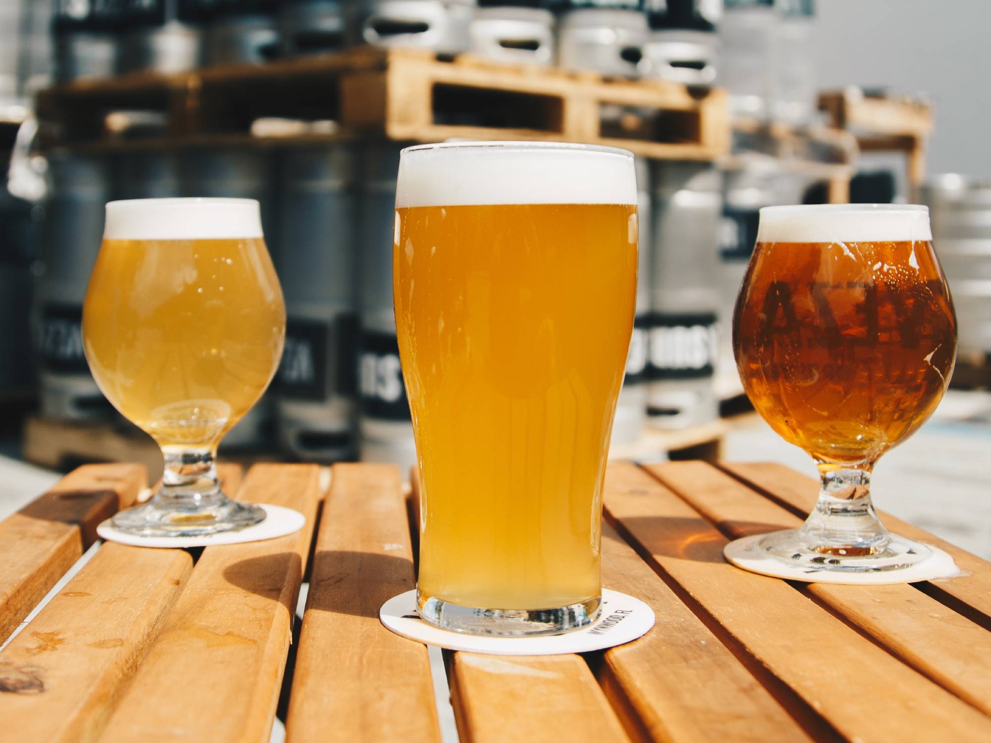 three glasses of beer on table