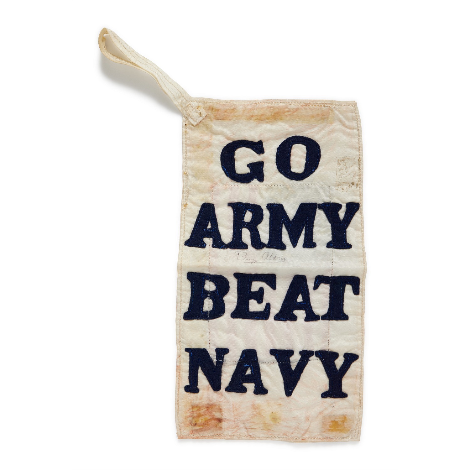 Small white banner with "go army beat navy" embroidered in blue letters