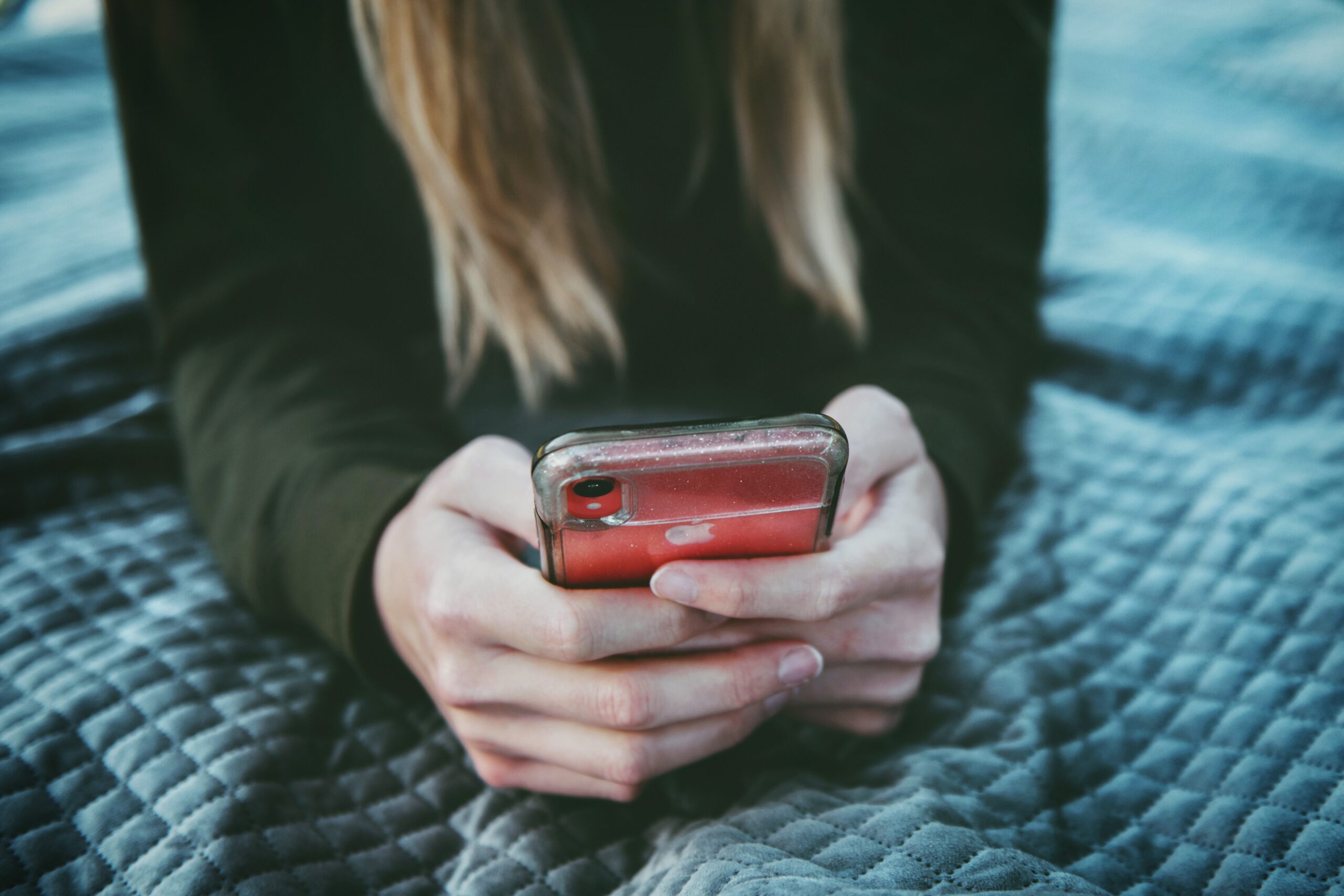 Woman looking at cell phone.