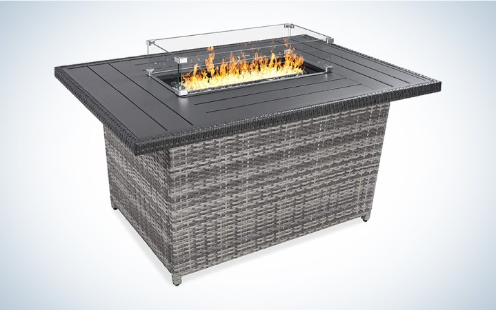  A fire pit table against a blue and white background