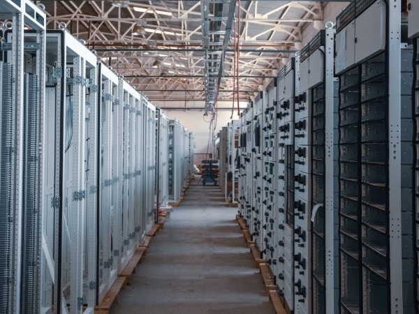 Aisle of computer server stacks in warehouse