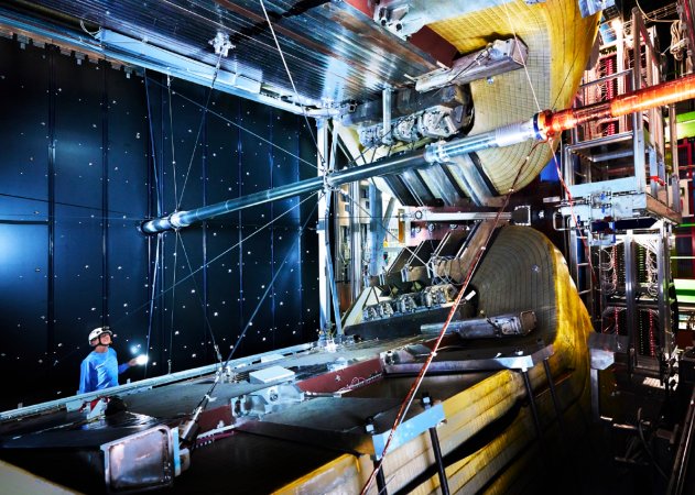 Large Hadron Collider experiment view with CERN staff in a hard hat standing near during the Europe gas crisis