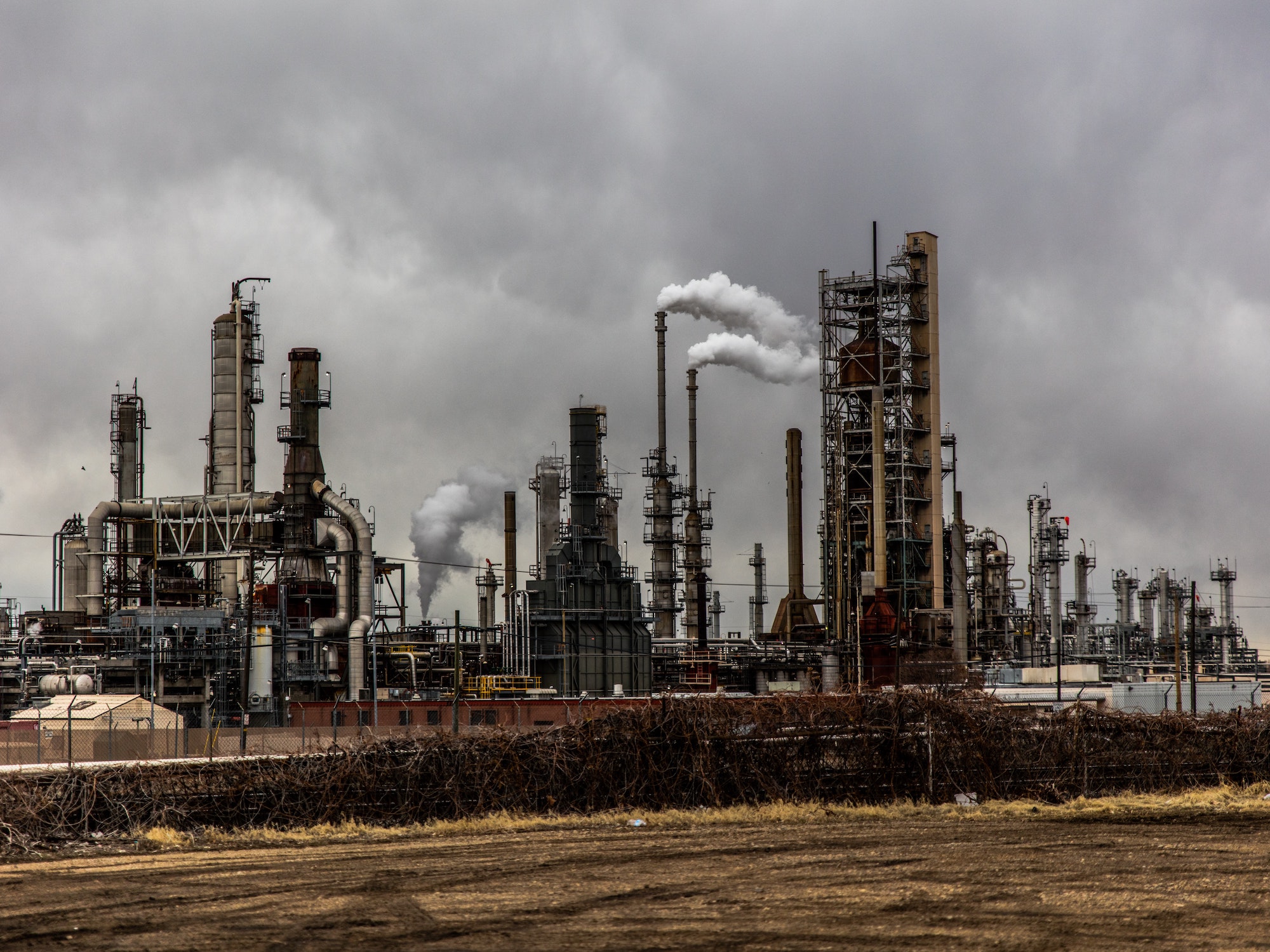 Industry factory against cloudy sky