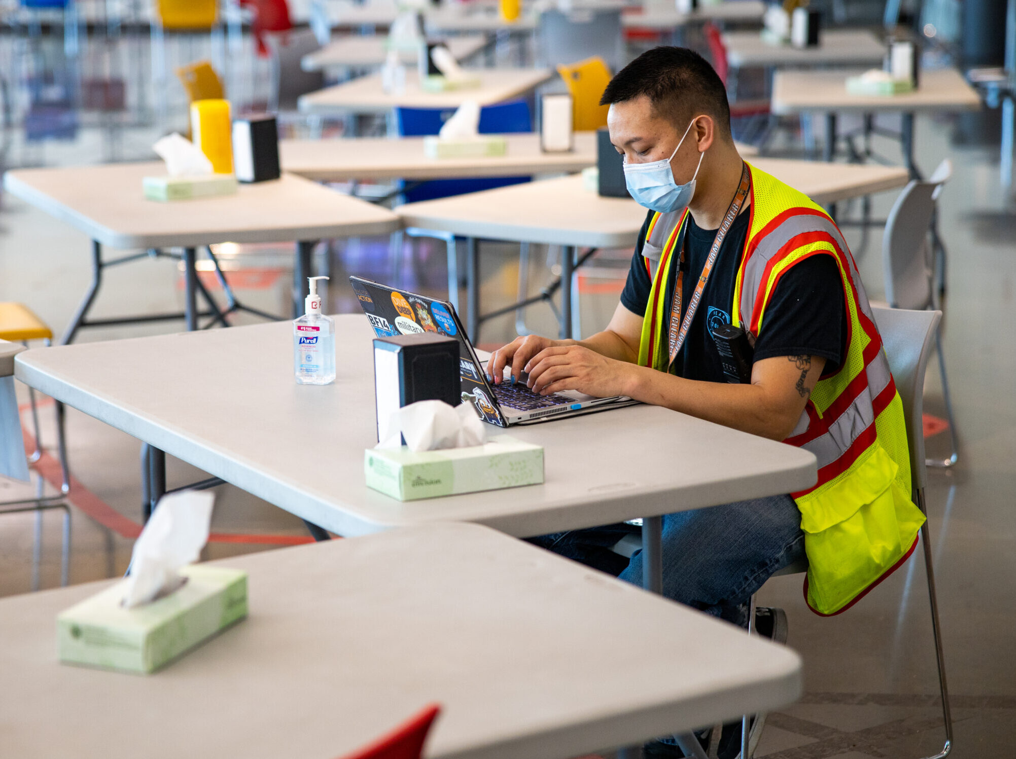 Amazon associate on laptop in breakroom