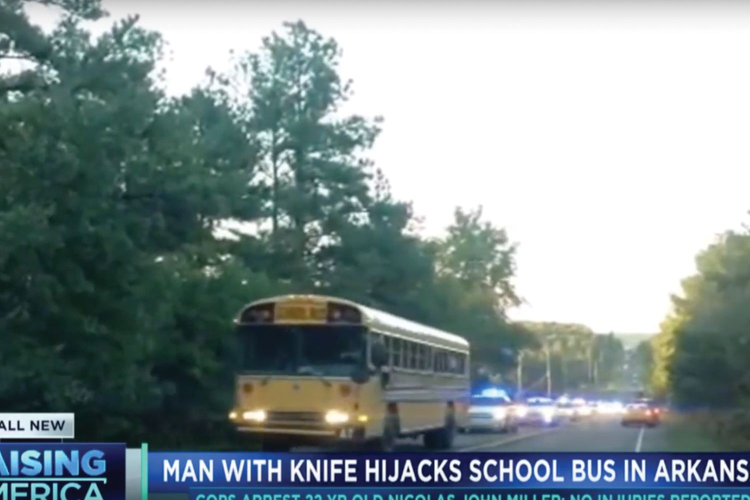 yellow school bus with police cars behind