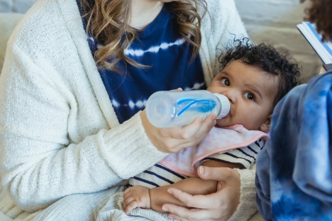 A baby bottle feeding