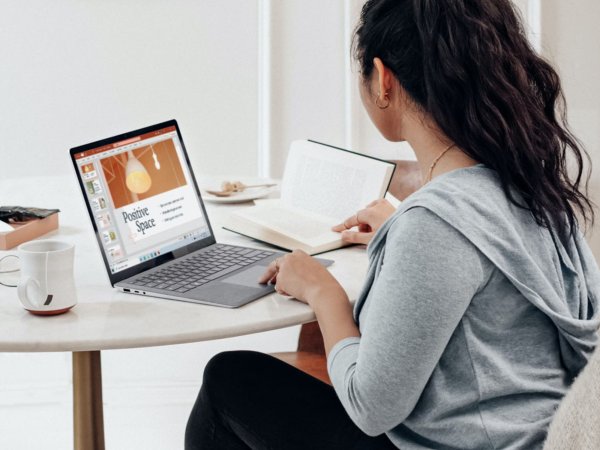 A person using Microsoft Office on their laptop