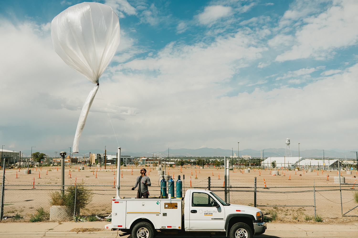 pickup truck with balloon behind it