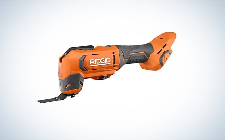  An orange RIGID cordless oscillating multitool on a blue and white background