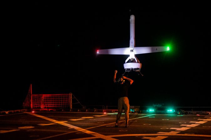 A VBAT vertical take-off and landing (VTOL) unmanned aerial system (UAS) prepares to land on the flight deck of the Military Sealift Command expeditionary fast transport vessel USNS Spearhead