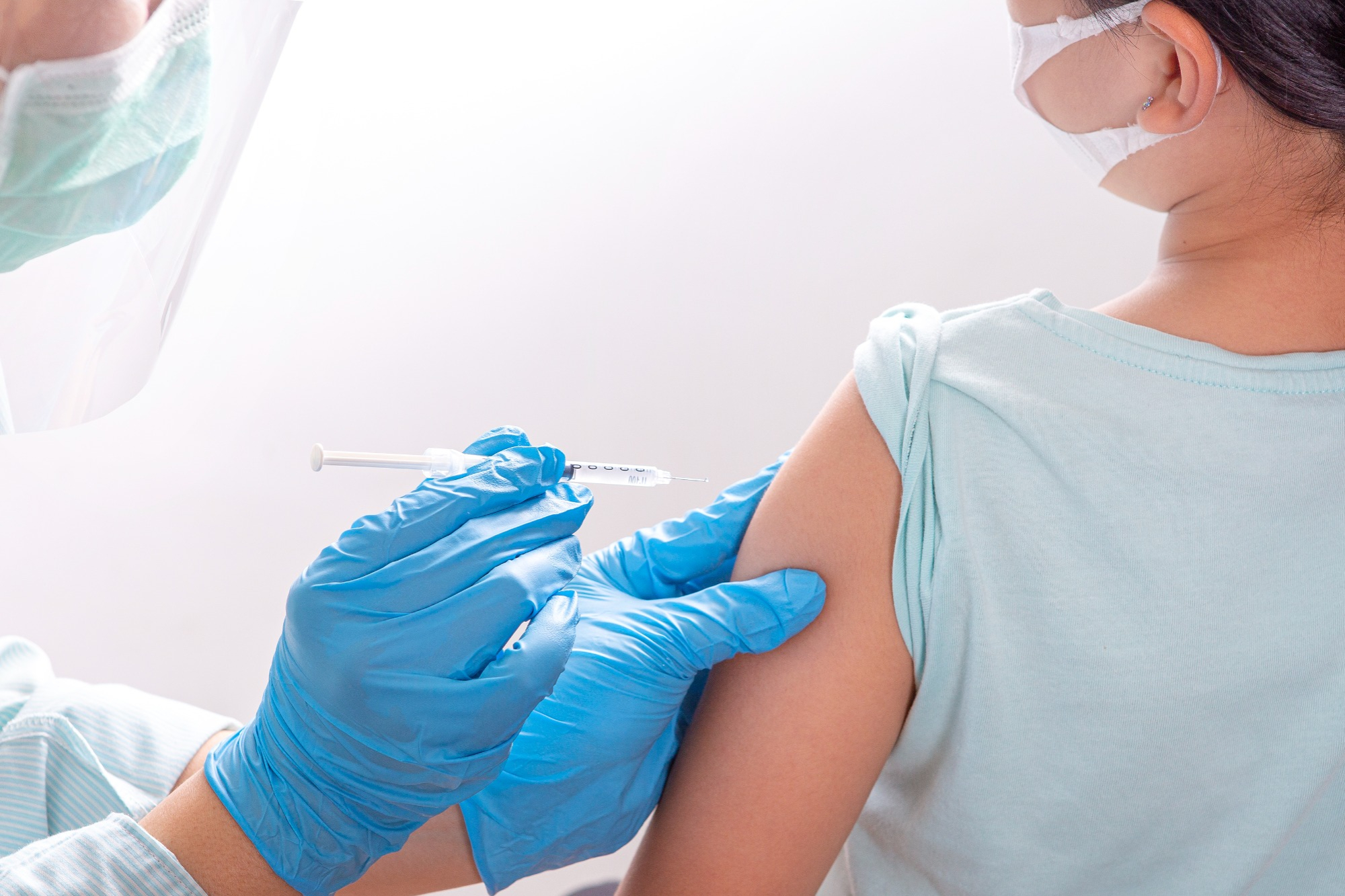 A child receives a COVID-19 vaccine