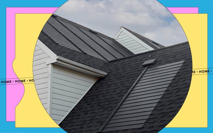  GAF Energy's solar shingles on the roof of a white house during the day with white clouds in the background.