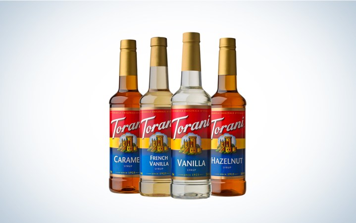  A variety of Torani syrups on a blue and white background