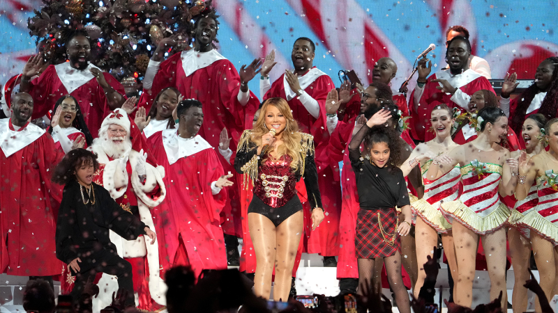 Singer Mariah Carey performs on stage with her twins Moroccan Cannon and Monroe Cannon during her "Merry Christmas To All!" at Madison Square Garden on December 13, 2022 in New York City.