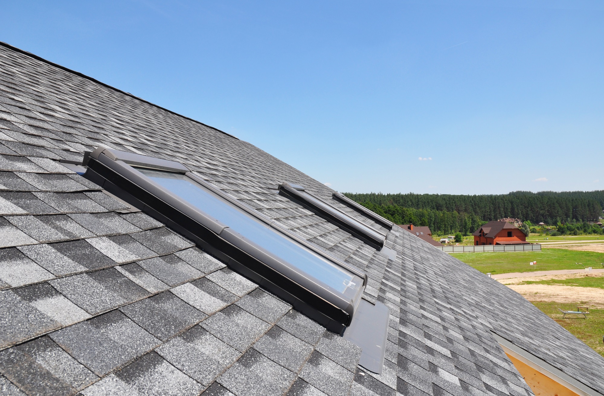 Skylights on the roof of a house without AC, seen from outside.