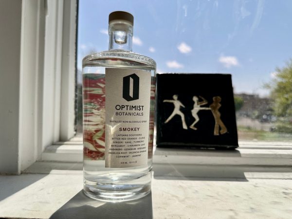  optimist non alcoholic tequila alternative in front of a window