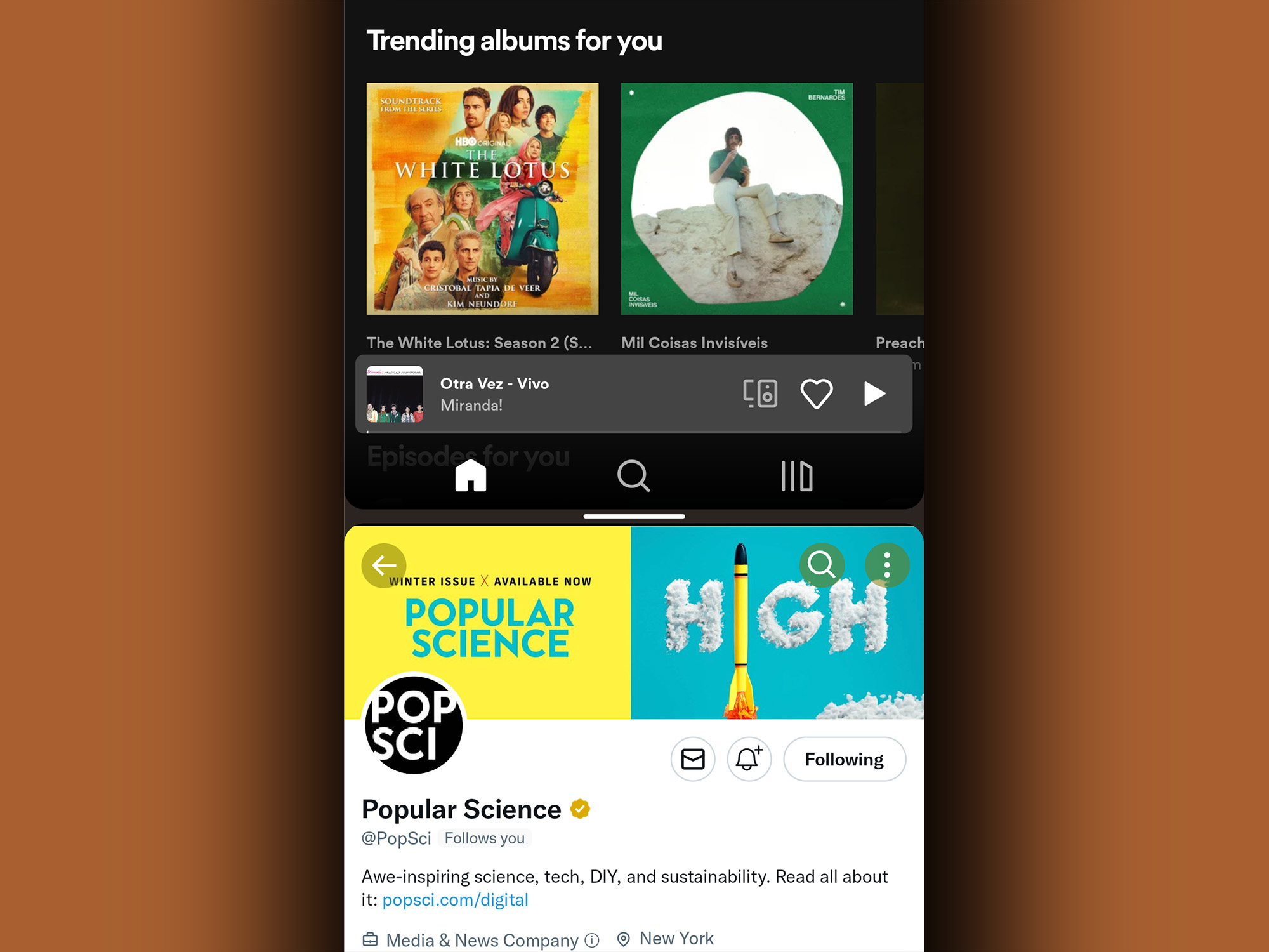 Android's split screen feature showing Spotify on the upper half of the screen and Twitter on the bottom half.