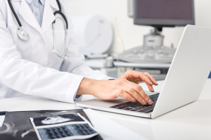 doctor on computer