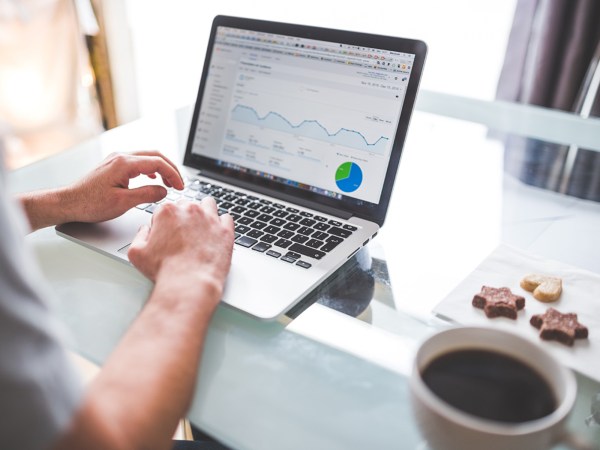 A person looking at a web analytics on their laptop