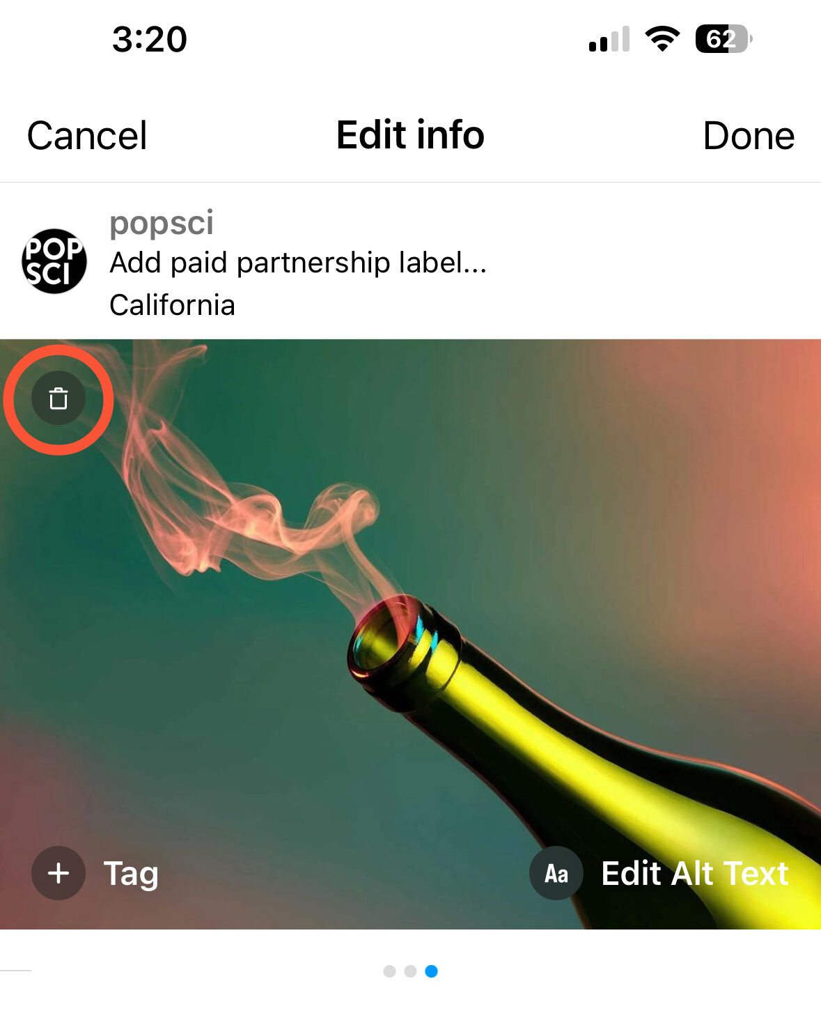 The trash can icon in the top left corner corner of an Instagram carousel photo of a bottle of wine with smoke coming out of it, used for deleting pictures from multiple-image posts.