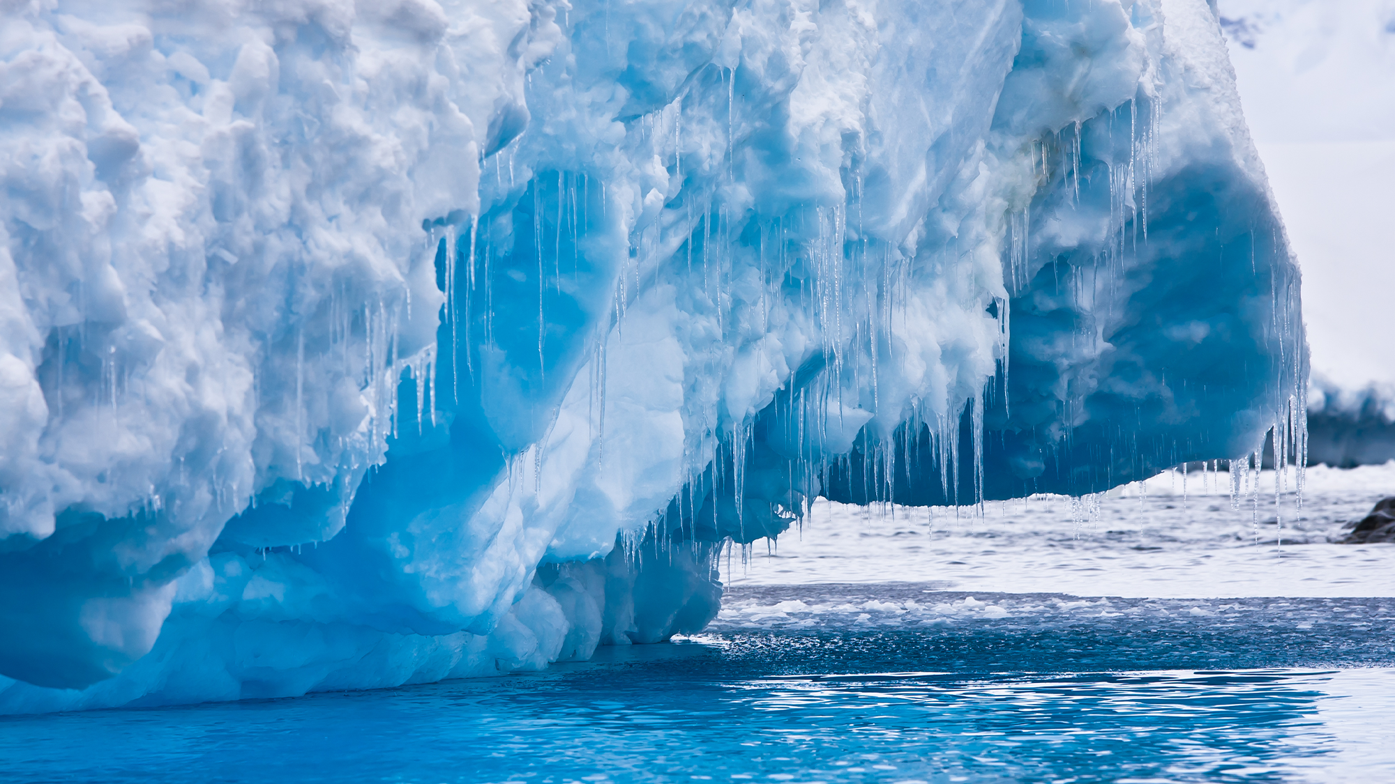 A glacier in Antarctica with water under it.