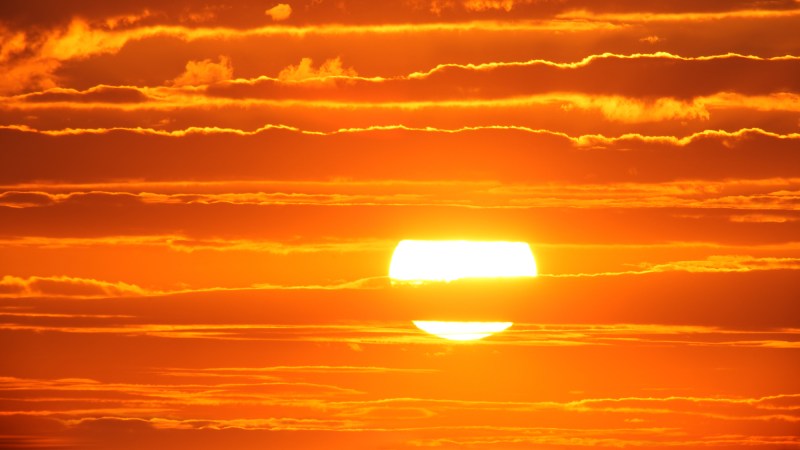 Scenic orange sunset sky background