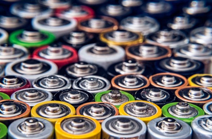 Old batteries in a rectangle formation waiting to be recycled.