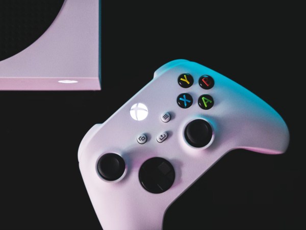 A white Xbox controller on a black background
