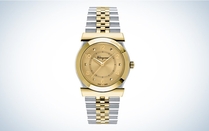  A gold and silver-toned Salvatore Ferragamo Men's watch on a blue and white background