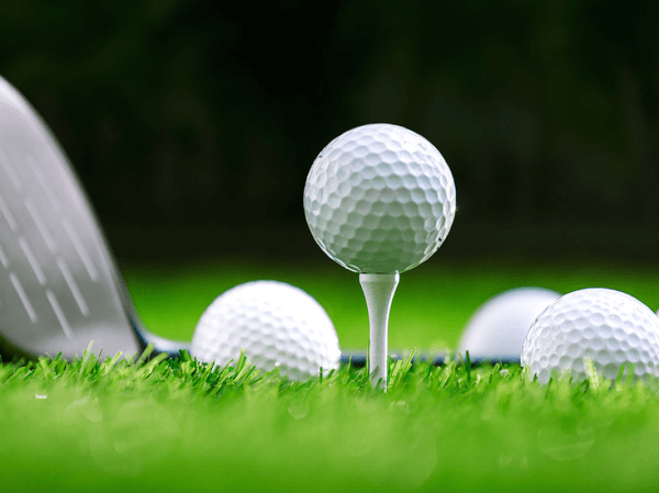 A golf ball sits on a tee