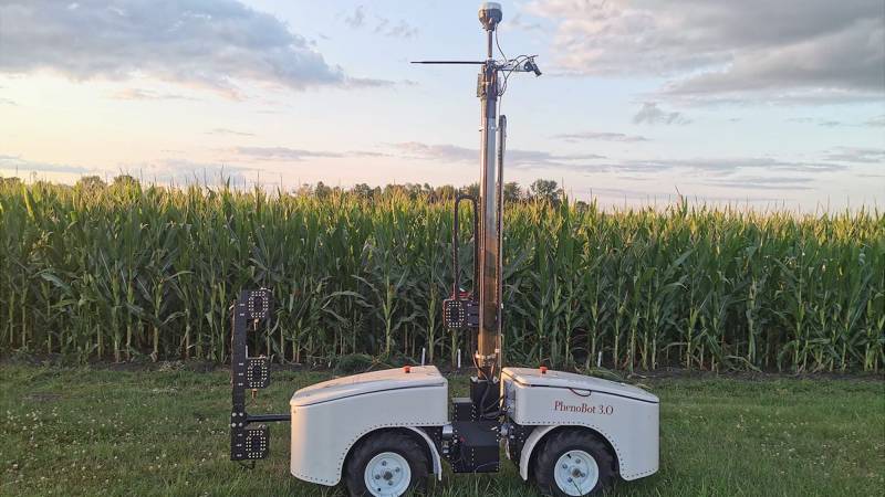 Corn stalk leaf measuring robot parked in front of field
