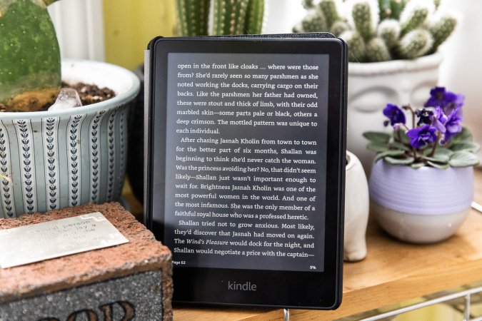 Kindle Paperwhite on a shelf with plants