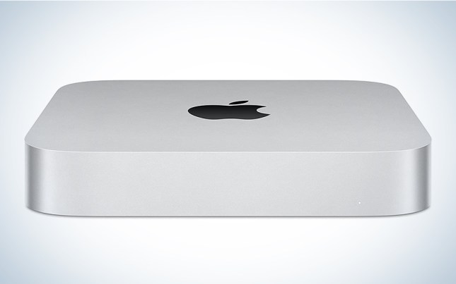 A grey Apple Mac Mini on a blue and white background