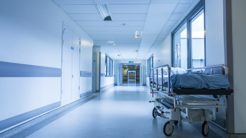 Empty Bed Gurney in Hospital Corridor