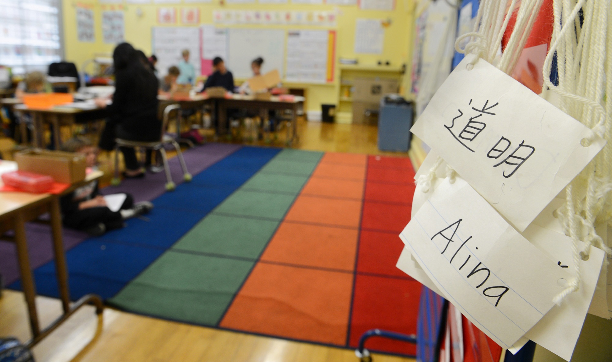 Chinese and English nametags hung up in an elementary school classroom