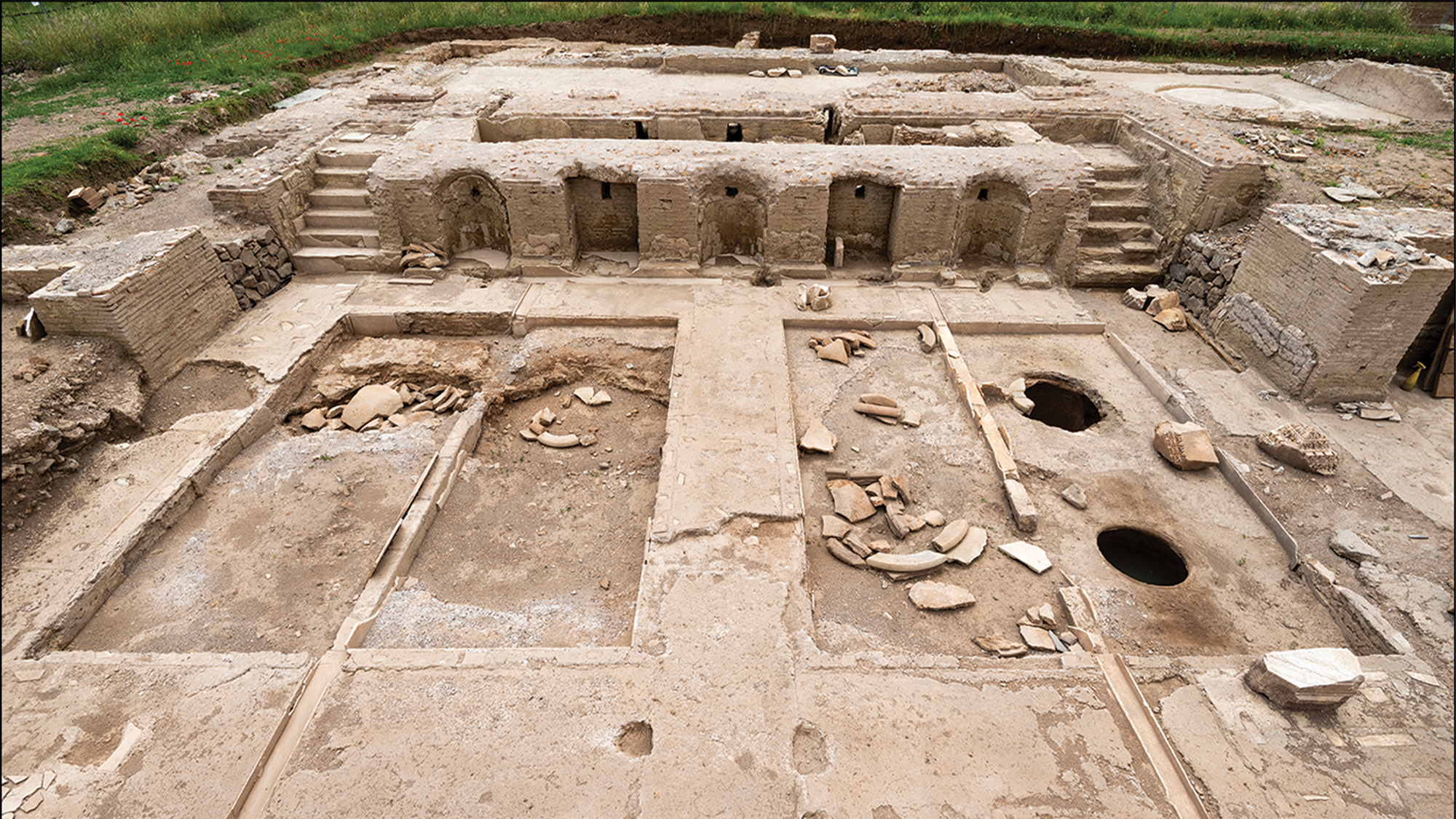 The dig at the Villa of the Quintilii. The cella vinaria are in the foreground and treading floor and presses are behind.