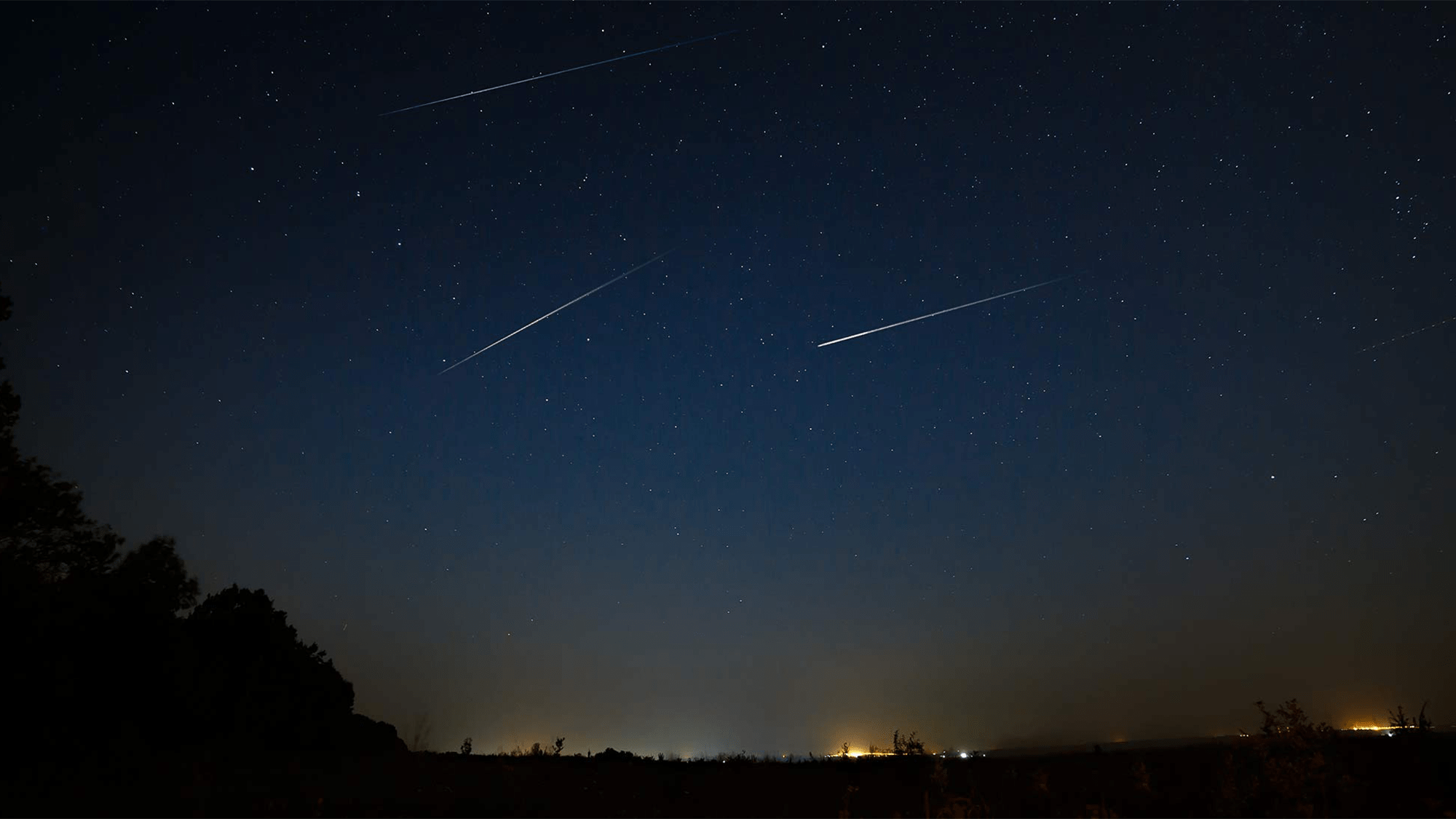 Meteorites fall during a meteor shower.