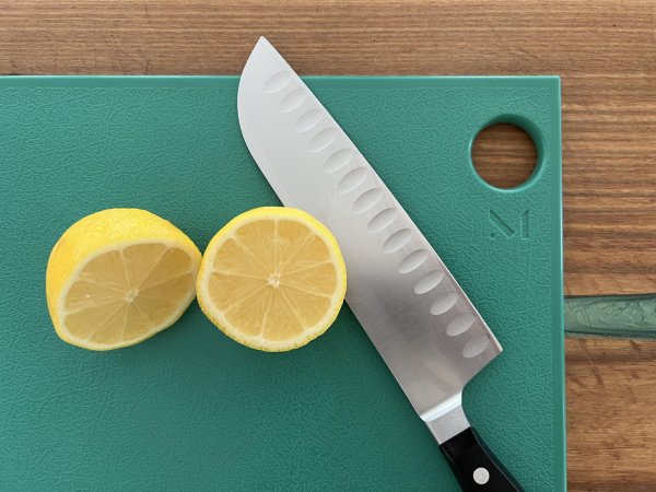  Material Cutting Board with lemon and knife on top