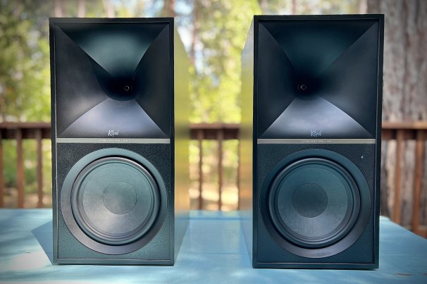 Klipsch The Nines powered speakers outside on a table in the sun