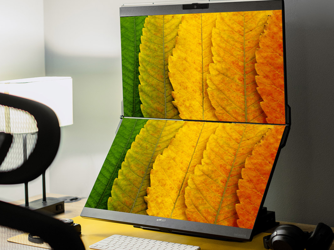 A dual screen monitor sitting on a desk