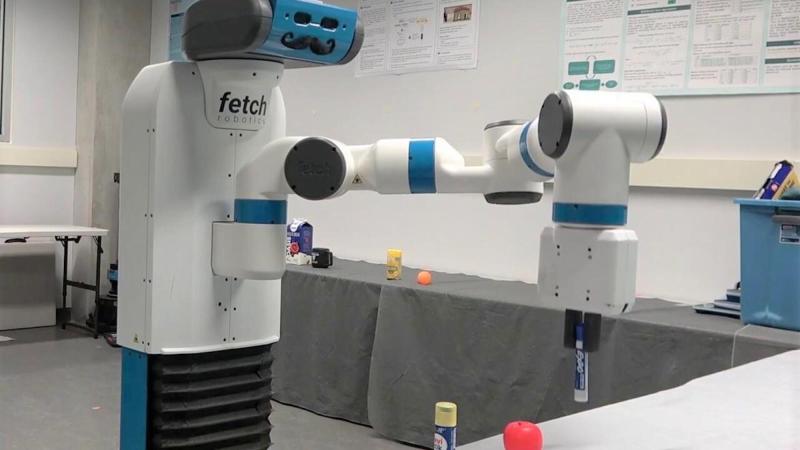 Fetch robot picking up dry erase marker off of table