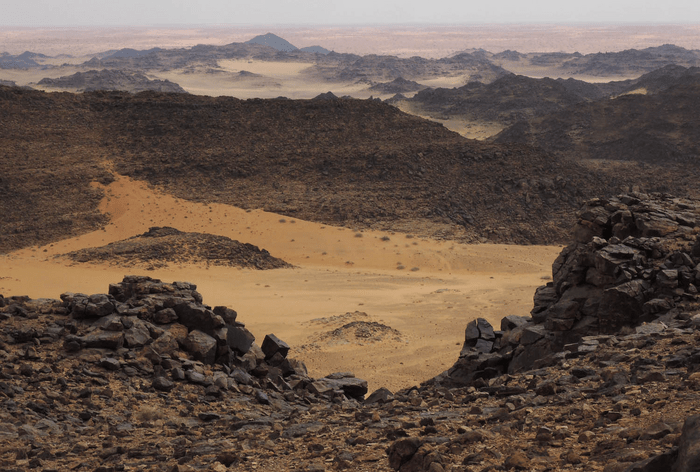 The desert landscape of Saudi Arabia with rocky hills where the engravings have been found.