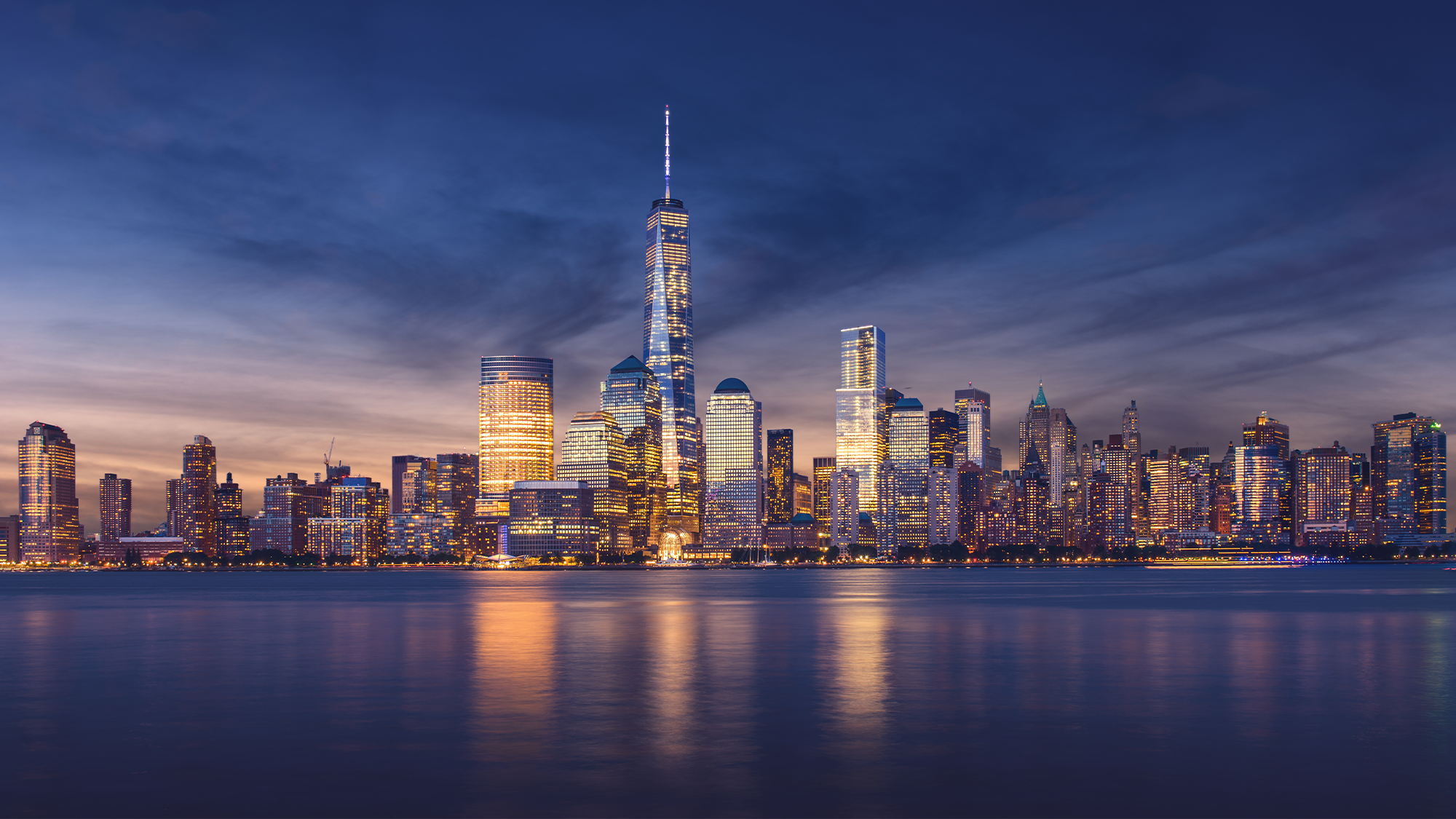 The lower Manhattan skyline at dusk.